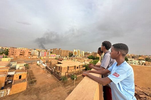 Watching smoke rise during clashes between the Sudanese Army and the Rapid Support Forces in the city of Omdurman on July 4.Credit...Reuters