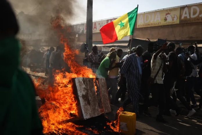 Police made arrests and fired tear gas at opposition supporters during protests against the decision by President Macky Sall to postpone February 25 vote [File: Cem Ozdel/Anadolu Agency]